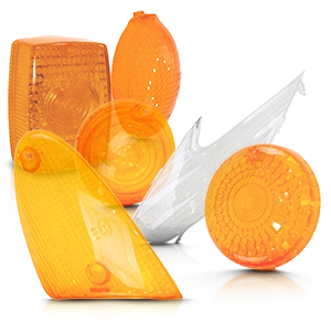 Différents verres de clignotants de moto orange et transparents de différentes formes.